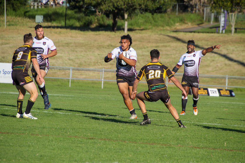 Sea Eagles prop Alec Tuitavake takes a hit-up against Mounties, with Jacob Sykes (left) in support.
